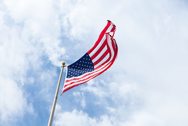 American flag against blue sky
