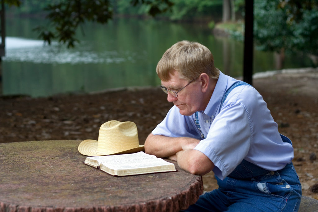 Man having his quiet time at a peaceful outdoor spot