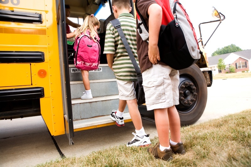 students-getting-on-bus