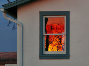 sunrise reflected in the window