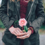 woman holding flower