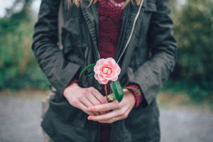 woman holding flower